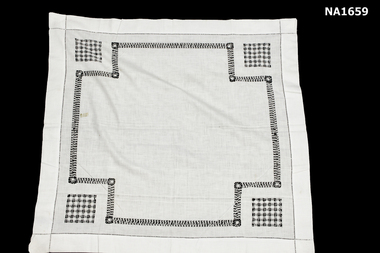  White supper cloth with draw thread work at each corner.