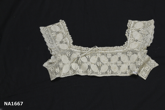 Square neck cream crochet yoke. 