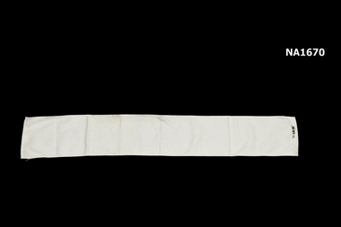 White flannel length used to bind baby's stomach after birth so that the navel would not stick out.