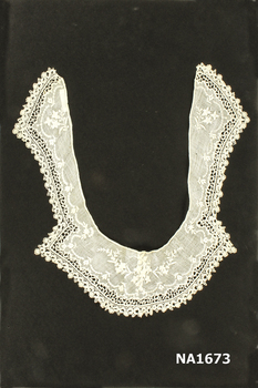 White lawn collar with embroidery and crochet edging.