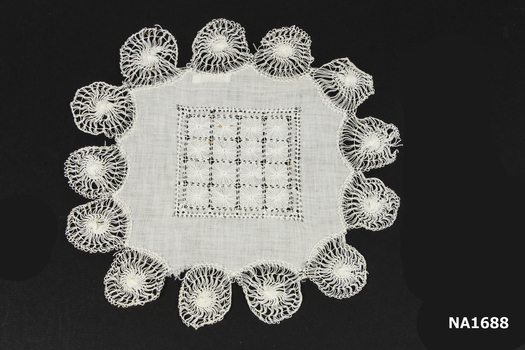 White cotton doyley with drawn thread needlework 