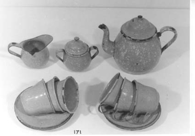 Blue enamel child's tea set with white speckle.