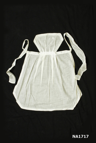 Small white cotton apron