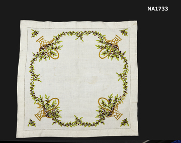 Linen square with embroidery of Boronia in baskets. 