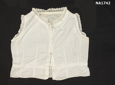 White cotton sleeveless camisole with white cotton crochet trim around neck and armhole edge.