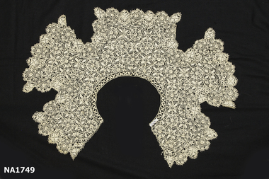 Large cream maltese lace collar.