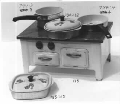 White painted toy stove with blue top. 