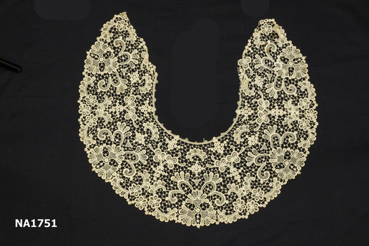 Large cream lace collar.