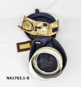 Soft black leather oval shaped case with strap at top. 