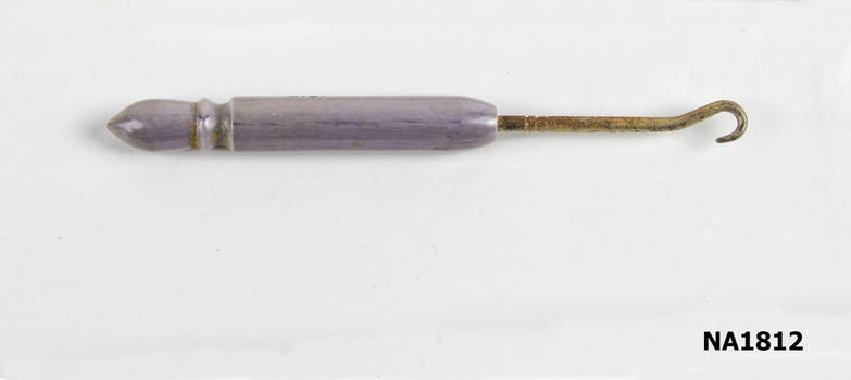 Button hook for buttons on shoes.