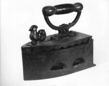 Box iron with lid to hold heated slugs.
