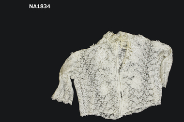 White heavy cotton lace blouse with high neck. 
