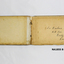 Woode covered book with illustration of three camels on front. 