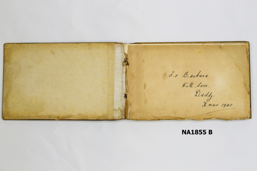 Woode covered book with illustration of three camels on front. 
