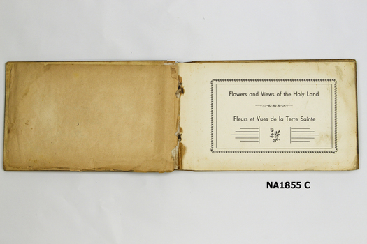 Woode covered book with illustration of three camels on front. 