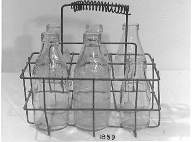  Metal milk carrier with six compartments. 