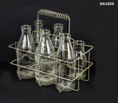 Metal milk carrier with six compartments. 