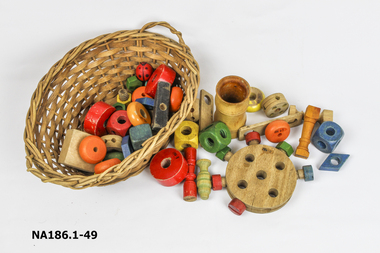 Small cane basket containing 47 blocks 