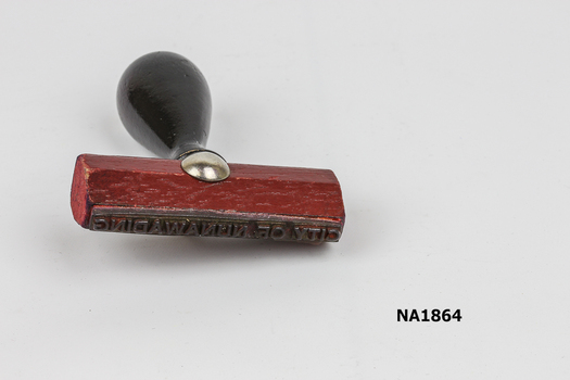 Rubber stamp - Wooden base with black handle.