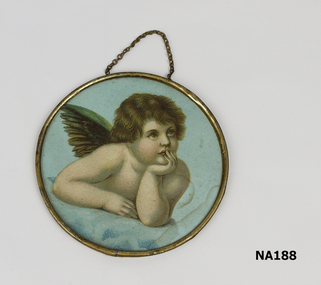 Round gold framed picture of pensive cherub