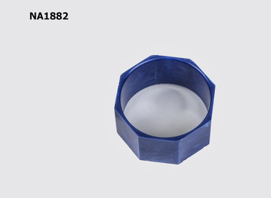An eight sided dark blue bakelite serviette ring.