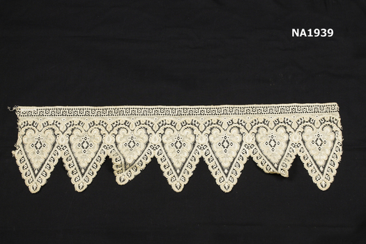 Cream cotton lace piece of needlelace. 