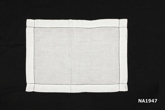 Plain white cotton tray cloth.