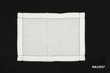Plain white cotton tray cloth.