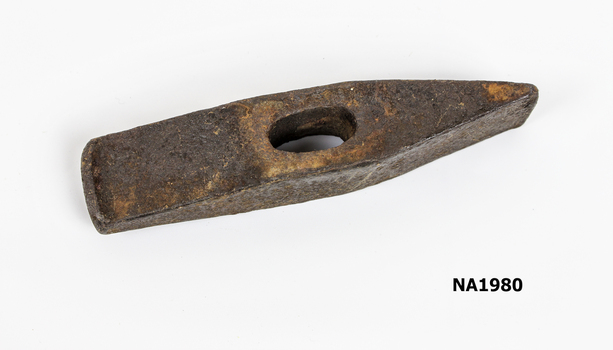 Hammer head with hole formed for handle in centre. 