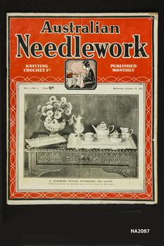 Large paper back book with illustration of flowers, tea set and doyleys on side board.
