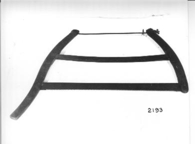 Large metal saw with slightly curved sides 