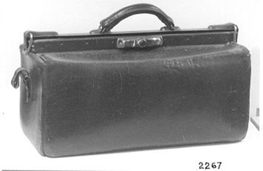 Brown leather gladstone bag.