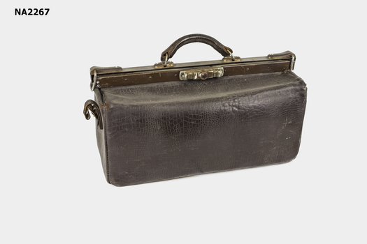 Brown leather gladstone bag.