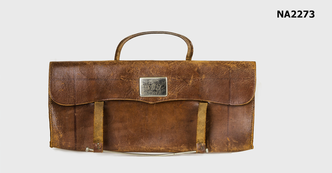 Brown leather music case. 