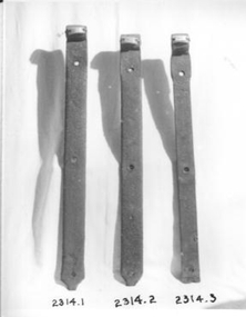 Three hinges made from disused wrought iron 