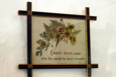 Religious picture of flowers and 'Christ Jesus Came Into The World To Save Sinners'.