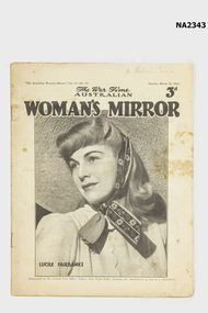 Magazine with woman in head scarf on front.