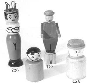  Peg shaped red and white doll