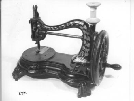 Small hand operated sewing machine