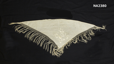 Cream triangle. Cream floral embroidery.