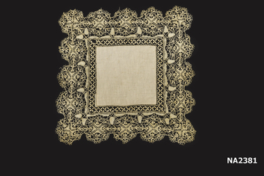 Square doyley, machine made lace with cotton insert.