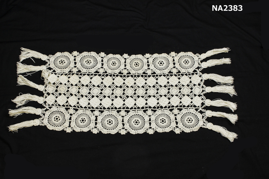 White cotton crochet table runner. 