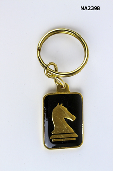 Key ring- black background, gold surrounds, 