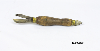 Tin opener - large wooden section with metal piercing