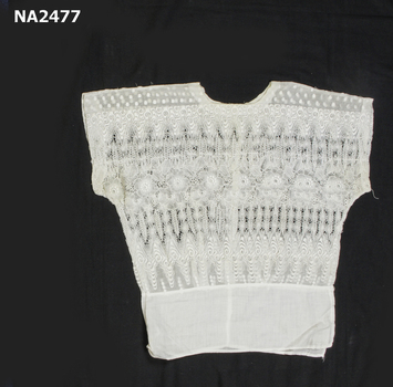  blouse with cotton piece sewn on bottom.
