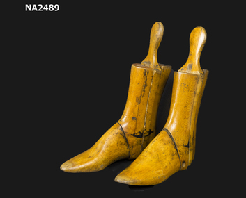 A pair of wooden shoe trees.