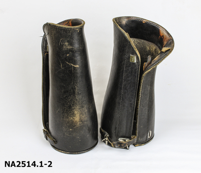 Pair long black leather riding gaiters 