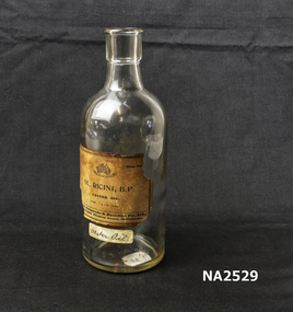 Clear glass bottle with cork.