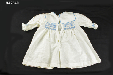  smocked in blue at yoke and sleeve