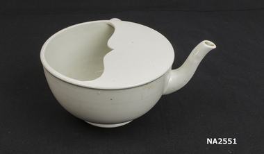 Large white ceramic feeding cup with spout and one handle.